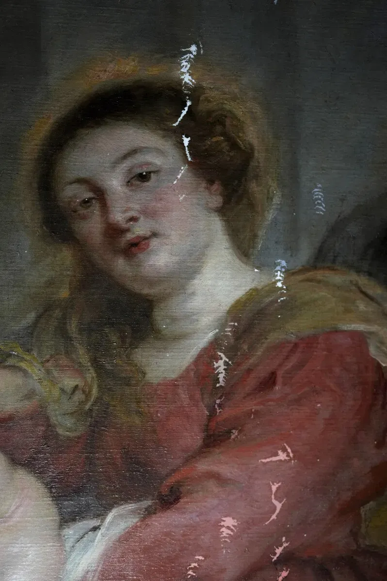 وجه امرأة من اللوحة "مادونا المتوجة المعشوقة من قبل القديسين" لروبنز، تظهر تفاصيل التعبير والملابس أثناء عملية الترميم.